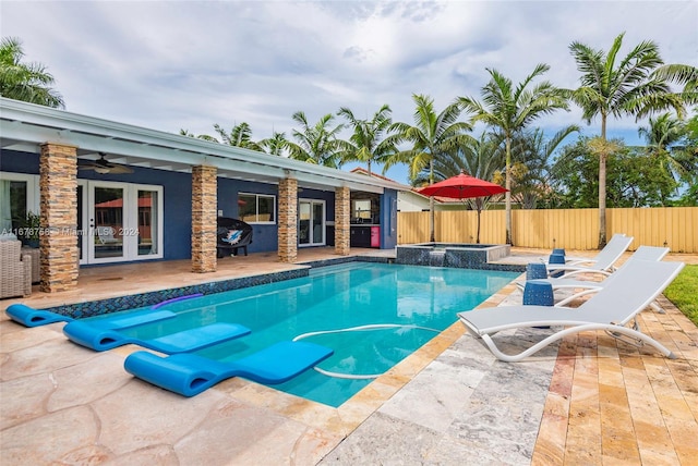 view of pool featuring a patio, ceiling fan, and french doors