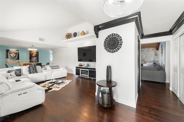 living room featuring an inviting chandelier, lofted ceiling, and dark hardwood / wood-style flooring