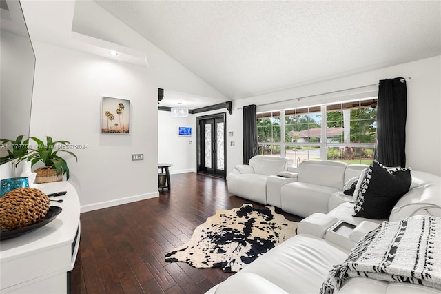 living room with high vaulted ceiling, french doors, dark hardwood / wood-style floors, and a textured ceiling