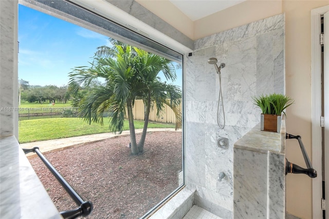 bathroom with a tile shower