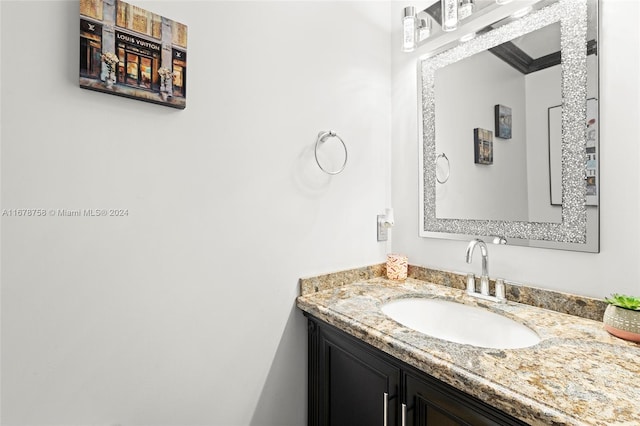 bathroom with vanity and ornamental molding