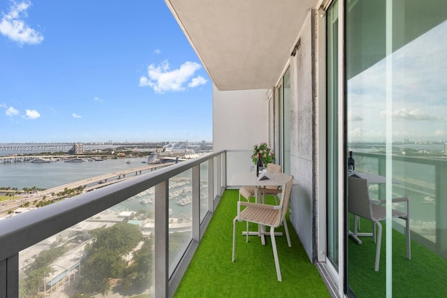 balcony featuring a water view