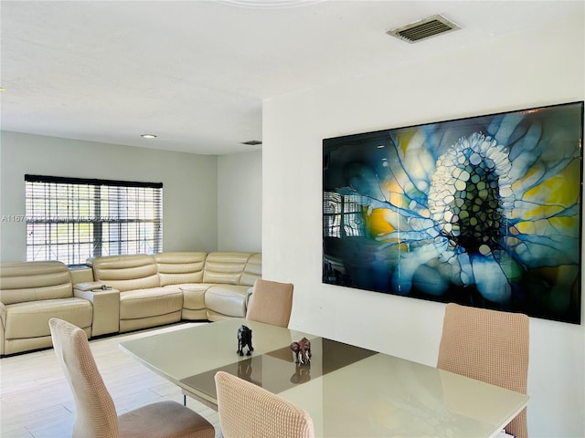 dining room with light hardwood / wood-style flooring