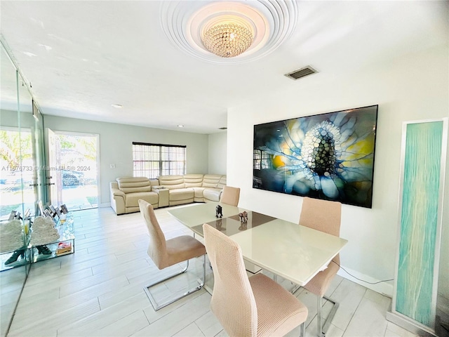 dining area with light hardwood / wood-style floors