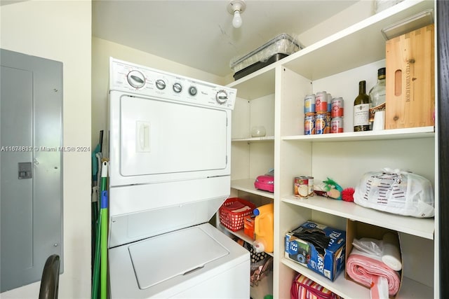 laundry room with stacked washer and clothes dryer