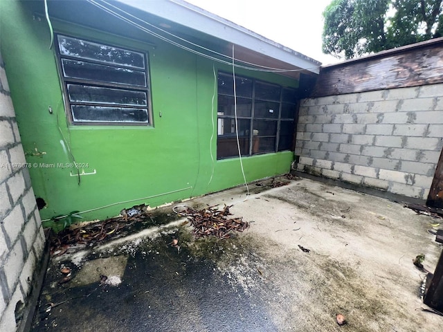 view of side of home with a patio