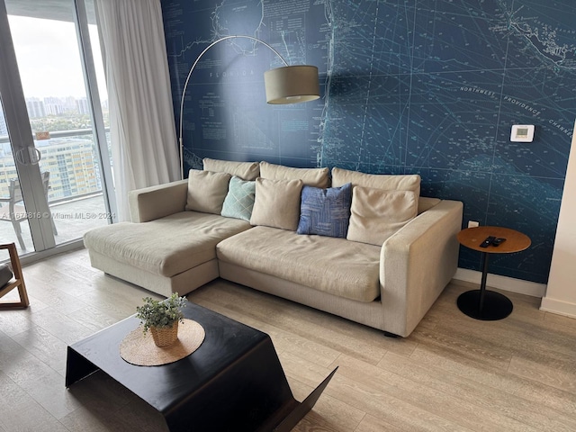 living room featuring french doors and hardwood / wood-style flooring