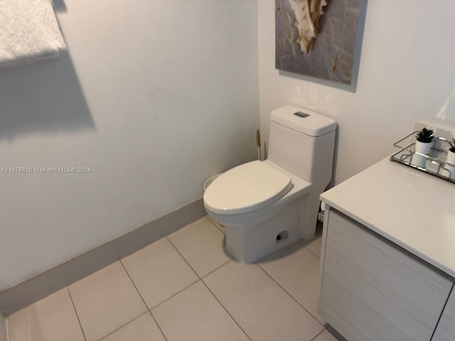 bathroom featuring vanity, toilet, and tile patterned floors