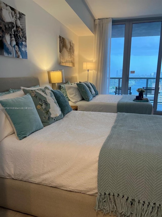 2602 E Hallandale Beach Blvd Unit R2105, Hallandale Beach, FL 33009 - bedroom featuring multiple windows and access to exterior