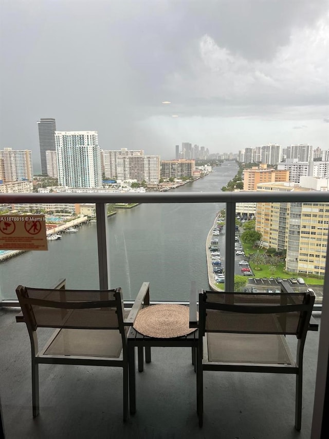 balcony featuring a water view