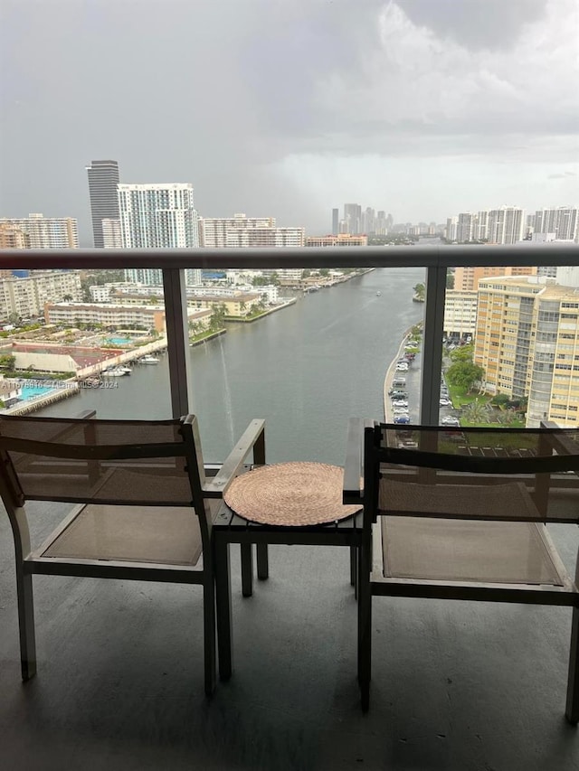 balcony featuring a water view