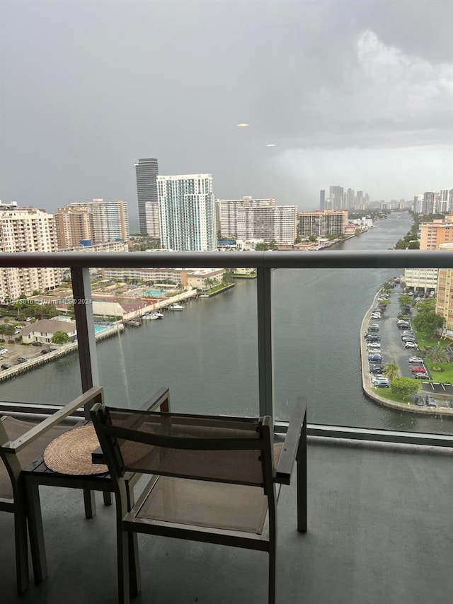 balcony featuring a water view