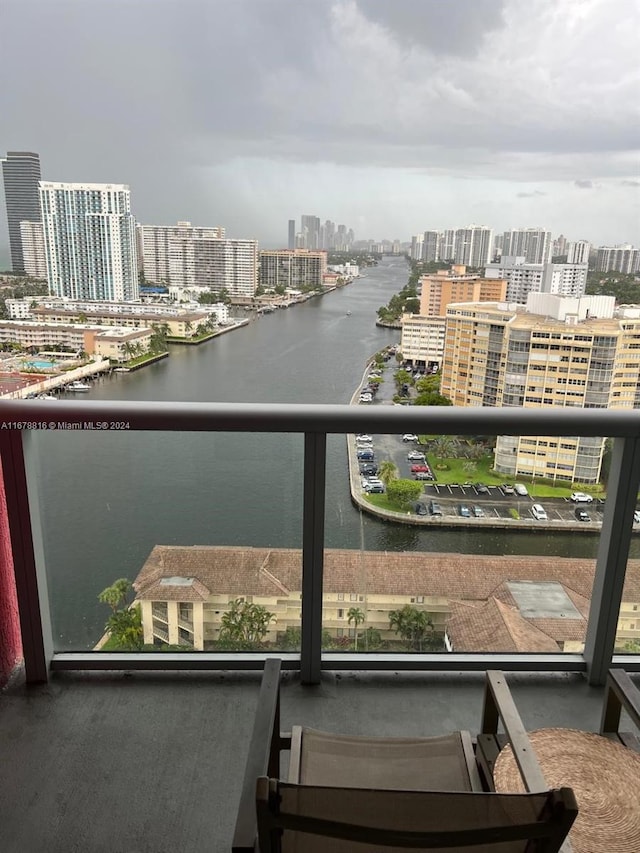 balcony featuring a water view