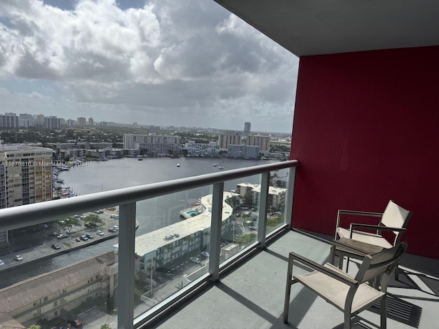 balcony featuring a water view