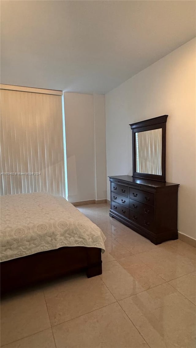 unfurnished bedroom featuring light tile patterned floors