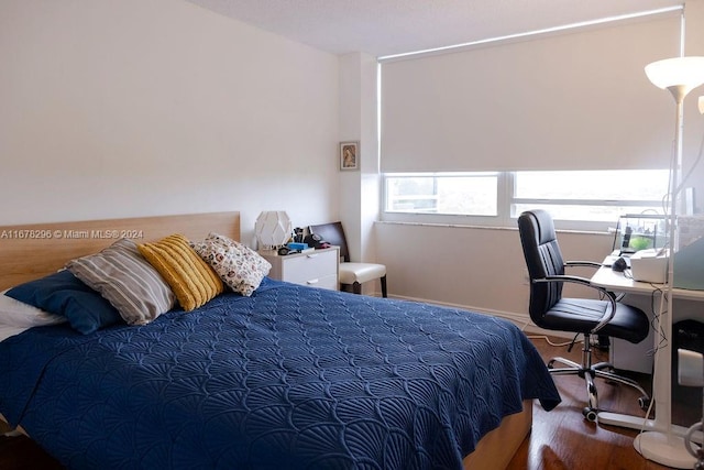 bedroom featuring wood-type flooring