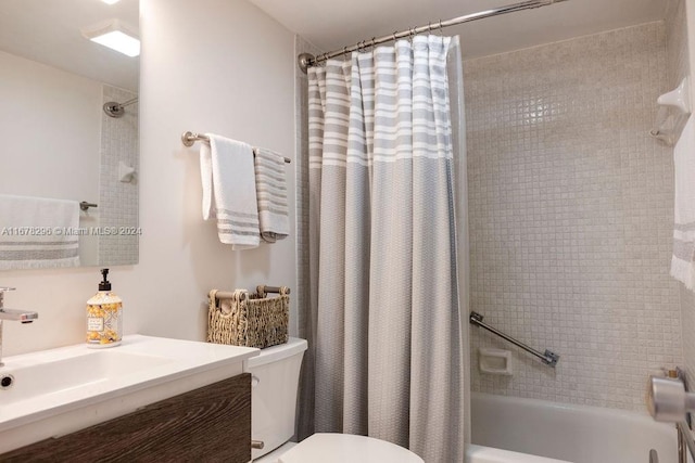 full bathroom featuring shower / bath combo, toilet, and vanity