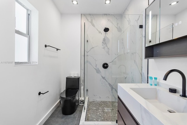 bathroom with vanity, toilet, and tiled shower