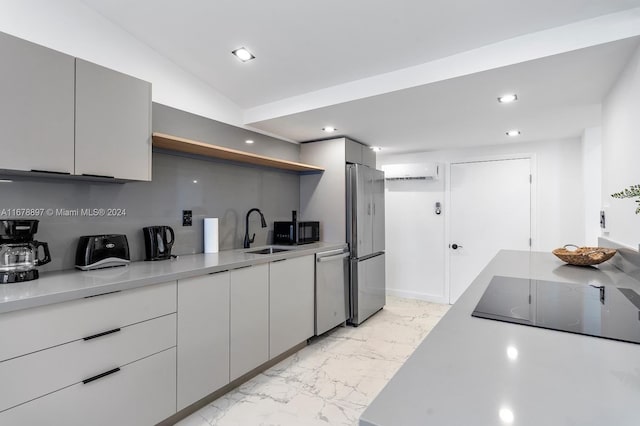 kitchen featuring sink, black appliances, vaulted ceiling, and gray cabinetry