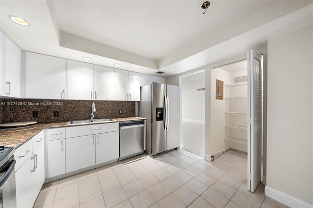 1627 Brickell Ave Unit 1906, Miami, FL 33129 - kitchen featuring appliances with stainless steel finishes, decorative backsplash, white cabinets, recessed lighting, and light tile patterned floors