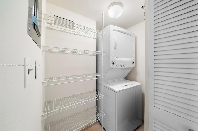 1627 Brickell Ave Unit 1906, Miami, FL 33129 - laundry room featuring stacked washer / dryer