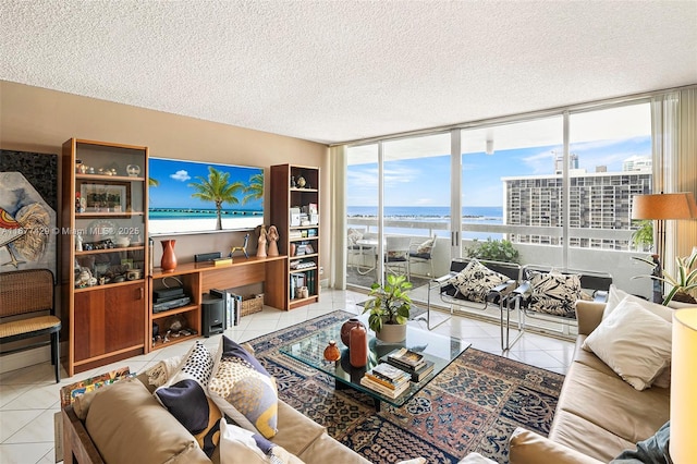 tiled living room with a wall of windows and a textured ceiling