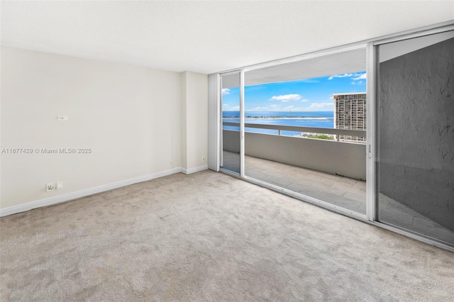 1627 Brickell Ave Unit 1906, Miami, FL 33129 - empty room featuring a water view and carpet