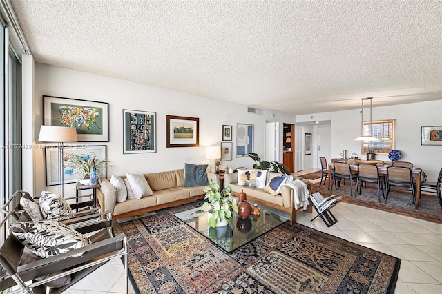 tiled living room with a textured ceiling