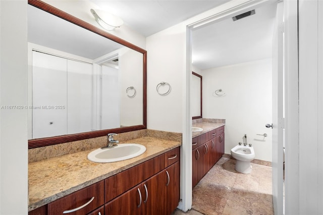 1627 Brickell Ave Unit 1906, Miami, FL 33129 - full bathroom featuring a bidet and vanity