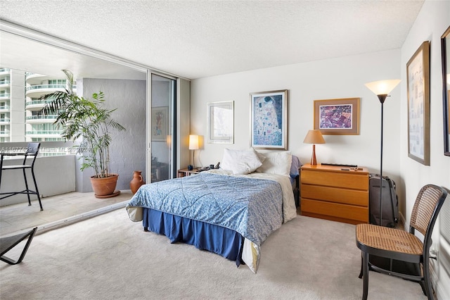 carpeted bedroom featuring multiple windows and a textured ceiling