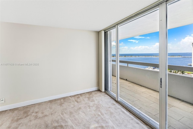 1627 Brickell Ave Unit 1906, Miami, FL 33129 - carpeted empty room with a water view and baseboards