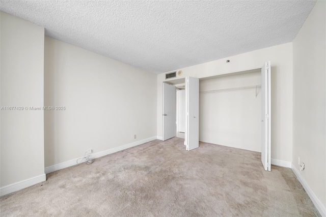 1627 Brickell Ave Unit 1906, Miami, FL 33129 - unfurnished bedroom with carpet, a textured ceiling, and a closet