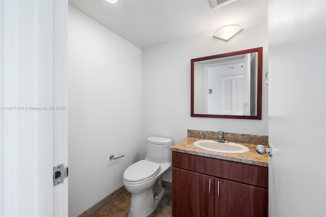 1627 Brickell Ave Unit 1906, Miami, FL 33129 - half bathroom featuring vanity and toilet