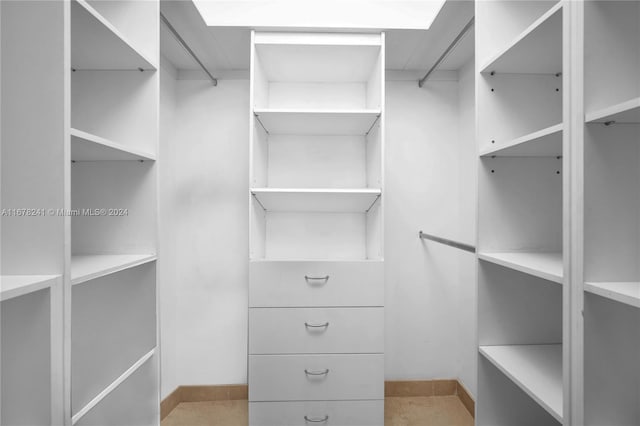 walk in closet featuring light tile patterned floors