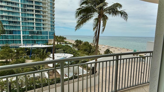 balcony with a view of the beach and a water view