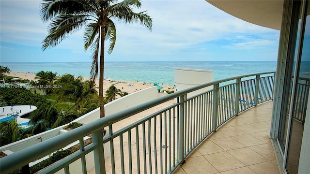 balcony with a view of the beach and a water view