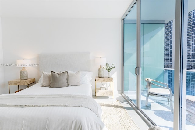 bedroom with floor to ceiling windows