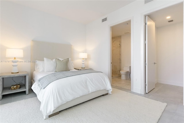 bedroom featuring connected bathroom