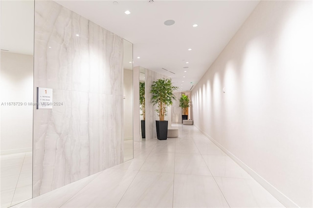 corridor with light tile patterned floors