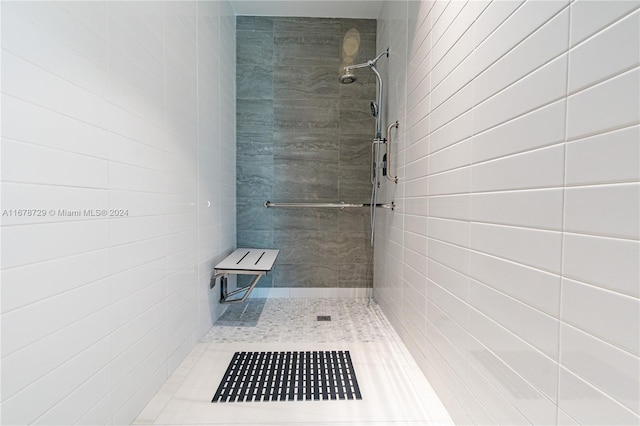 bathroom with a tile shower