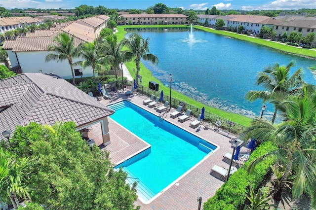 view of pool with a water view