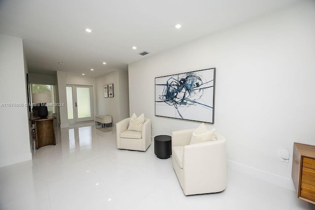 living area with french doors and tile patterned floors