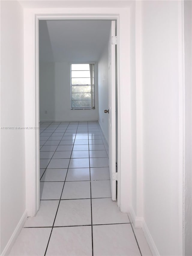 hallway featuring light tile patterned floors