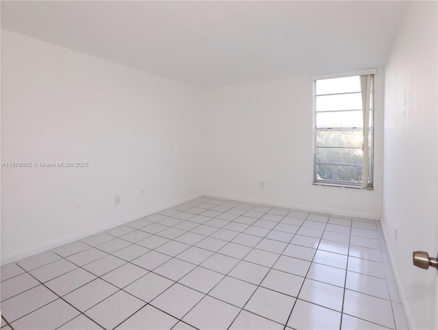 empty room featuring light tile patterned flooring