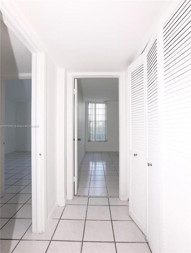 hallway with light tile patterned floors