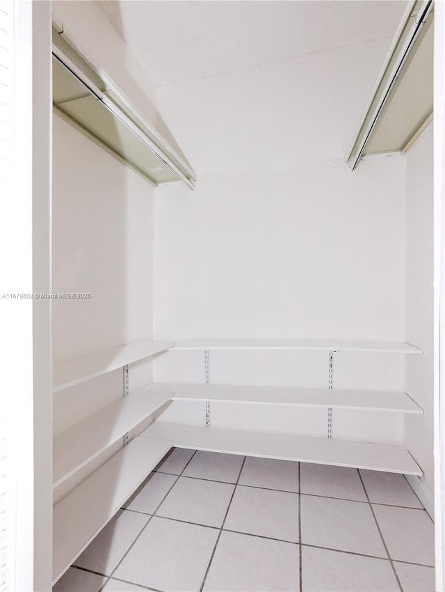 walk in closet featuring tile patterned floors