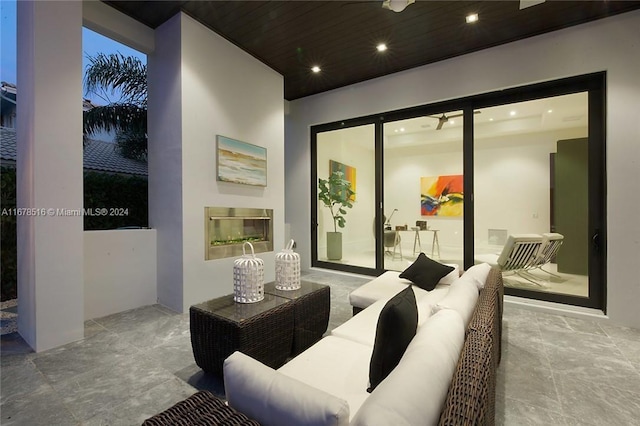 cinema room with wood ceiling and a fireplace