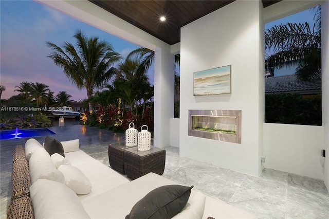 patio terrace at dusk with an outdoor living space