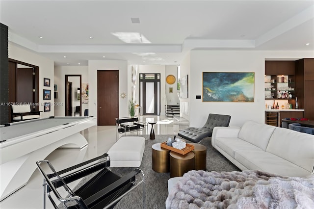 carpeted living room featuring wine cooler