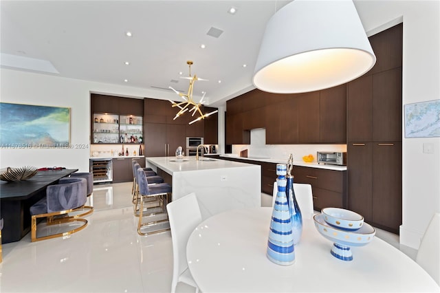 dining area with sink and beverage cooler